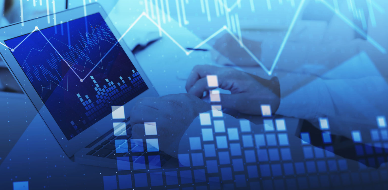 A blue toned strategy concept illustration with a blurry laptop and line charts across the screen